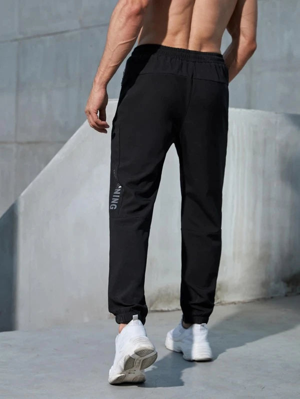 Men Letter Graphic Zip Pocket Drawstring Waist Sports Pants